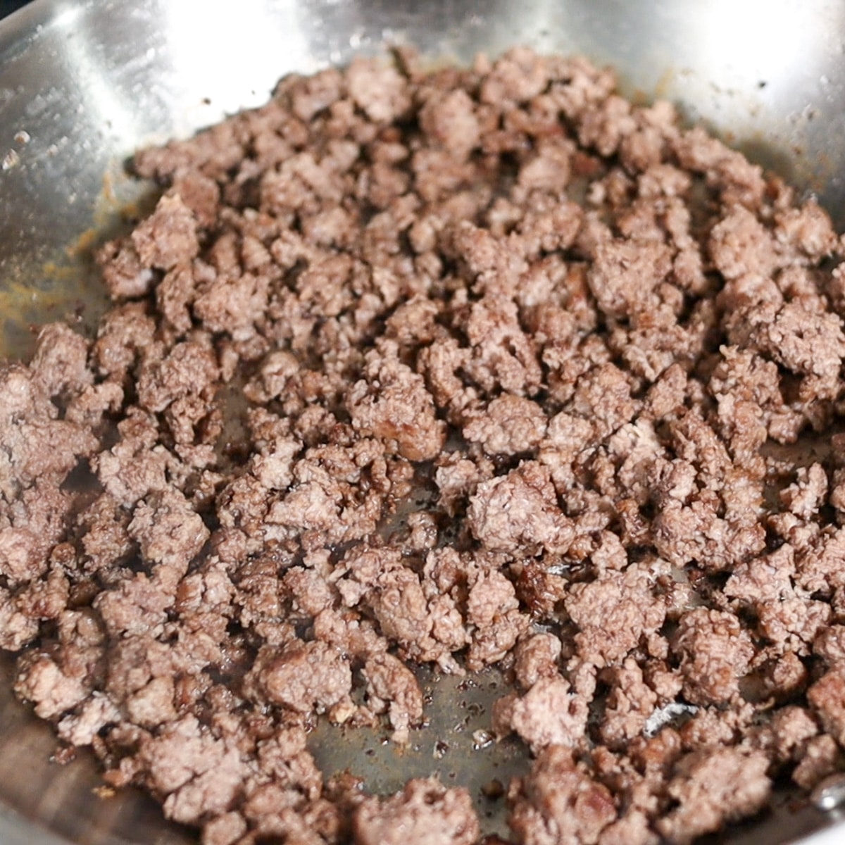 ground beef cooked in a pan            