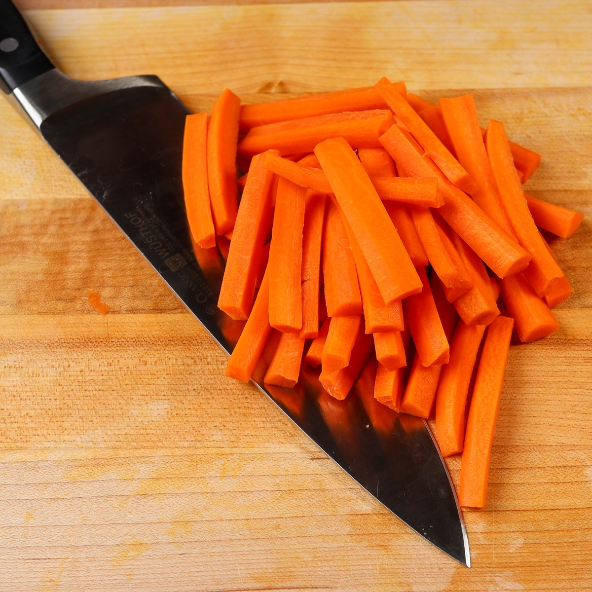 carrots julianned on a cutting board