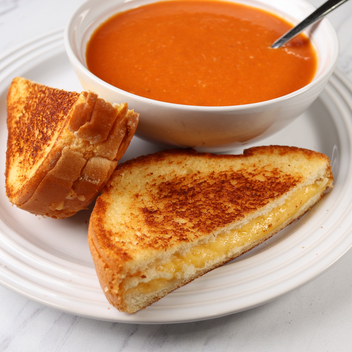 grilled cheese and tomato soup on a plate