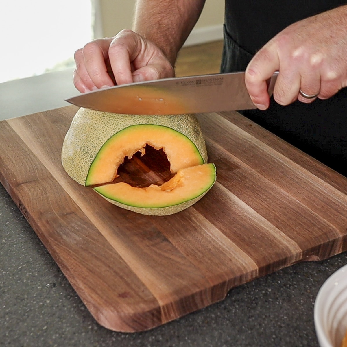 slicing the cantaloupe