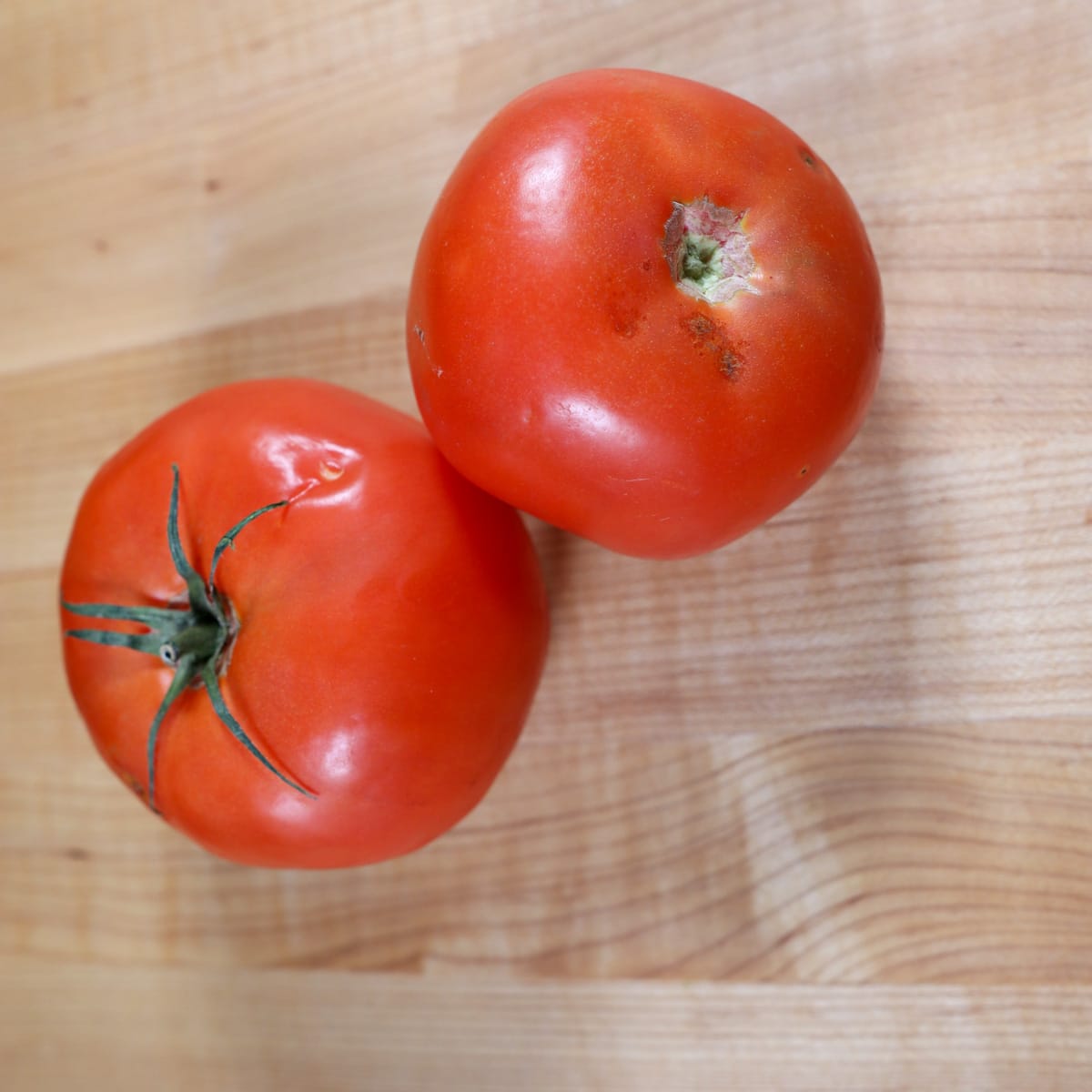 tomatoes gone bad on a cutting board
