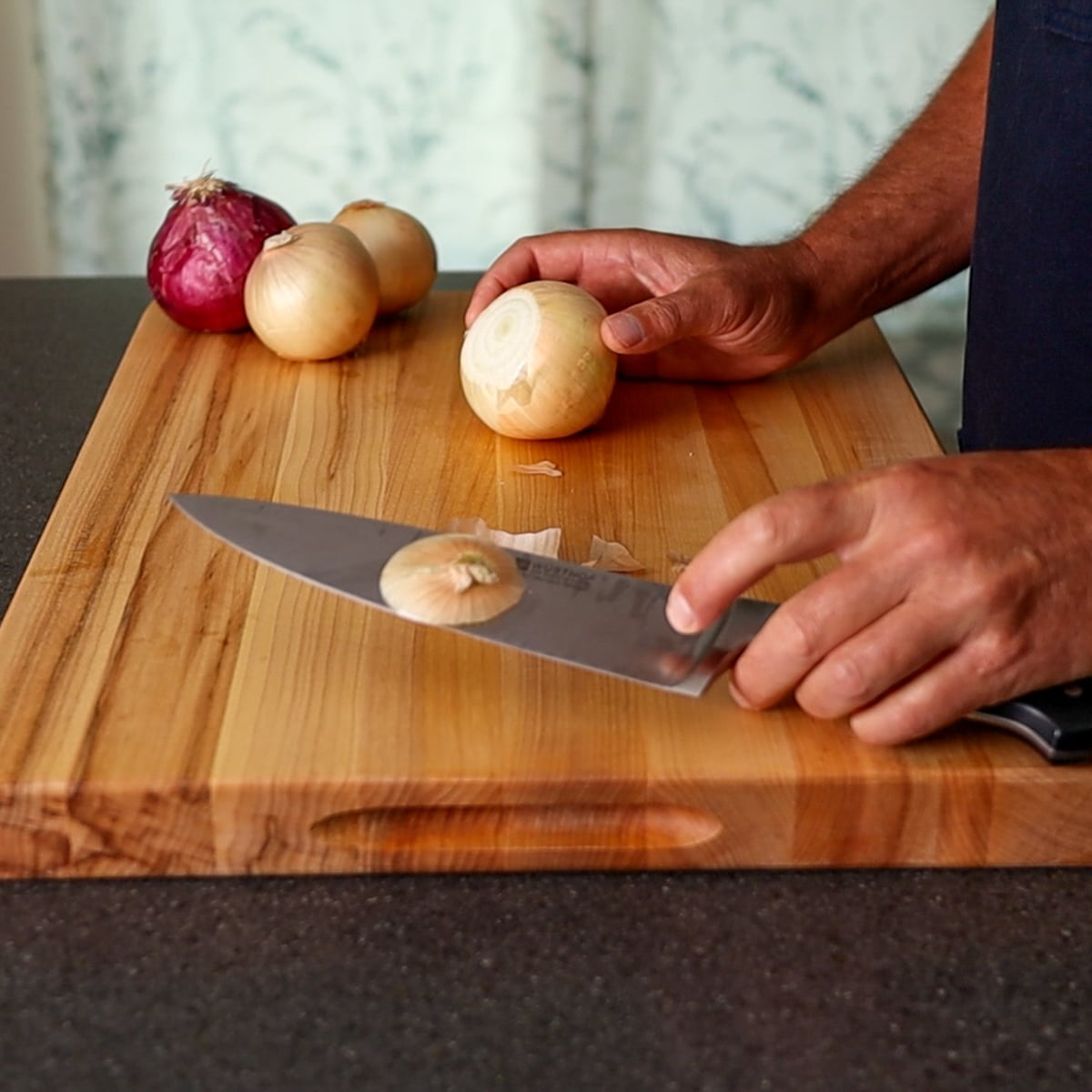 cutting onion rings on a cutting board