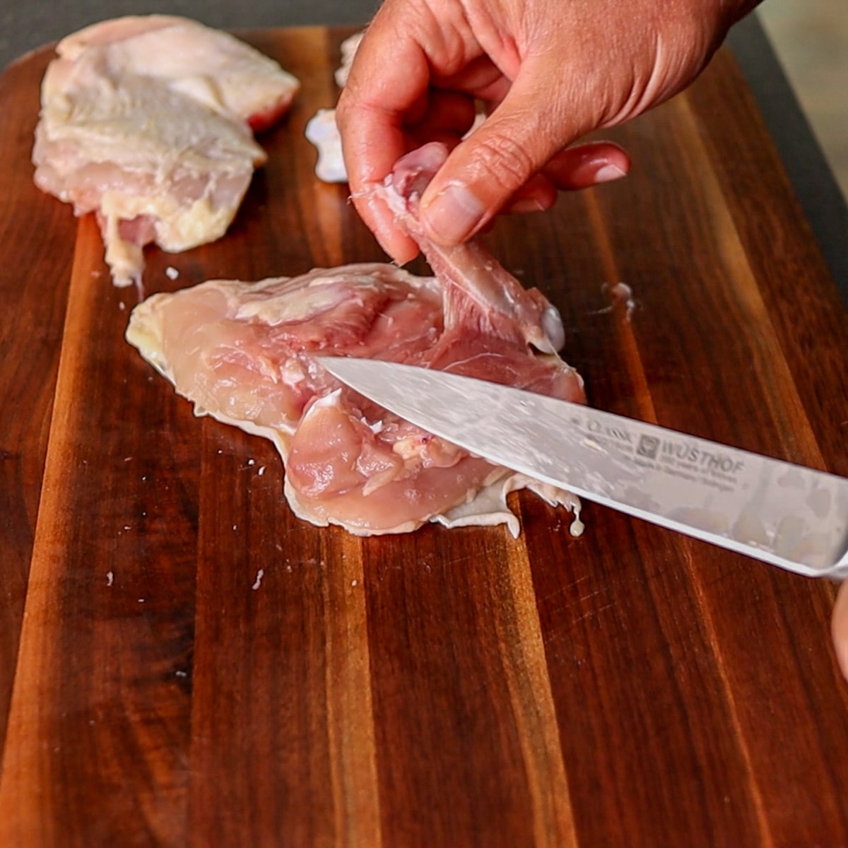 removing the bone from the chicken thigh
