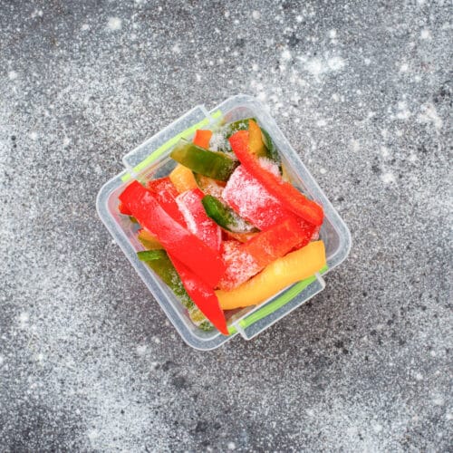Container with frozen bell pepper strips