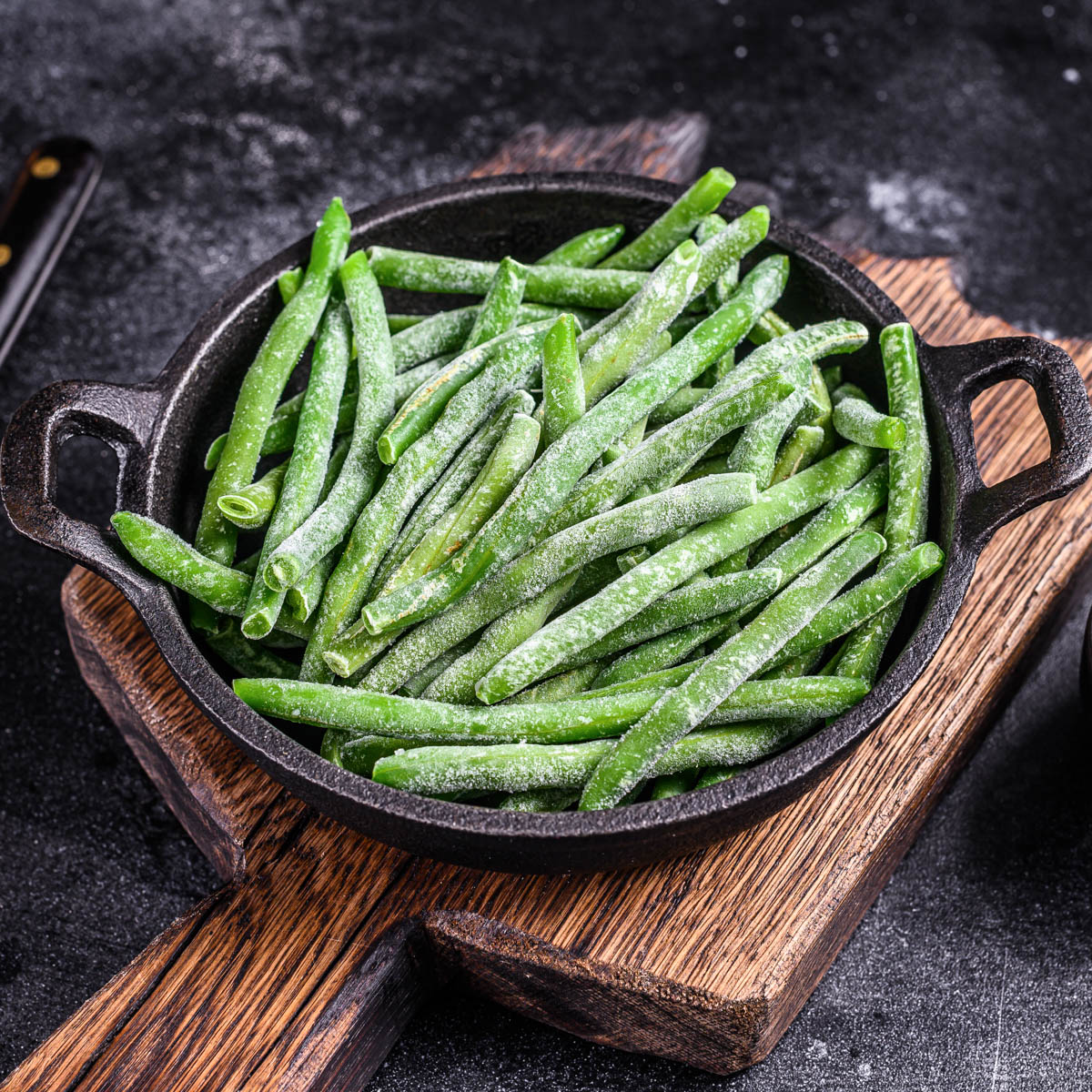 Frozen green beans in a cast iron skillet