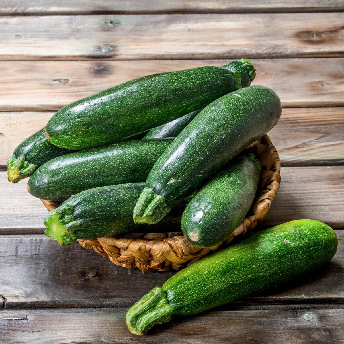 A small basket with fresh zucchini