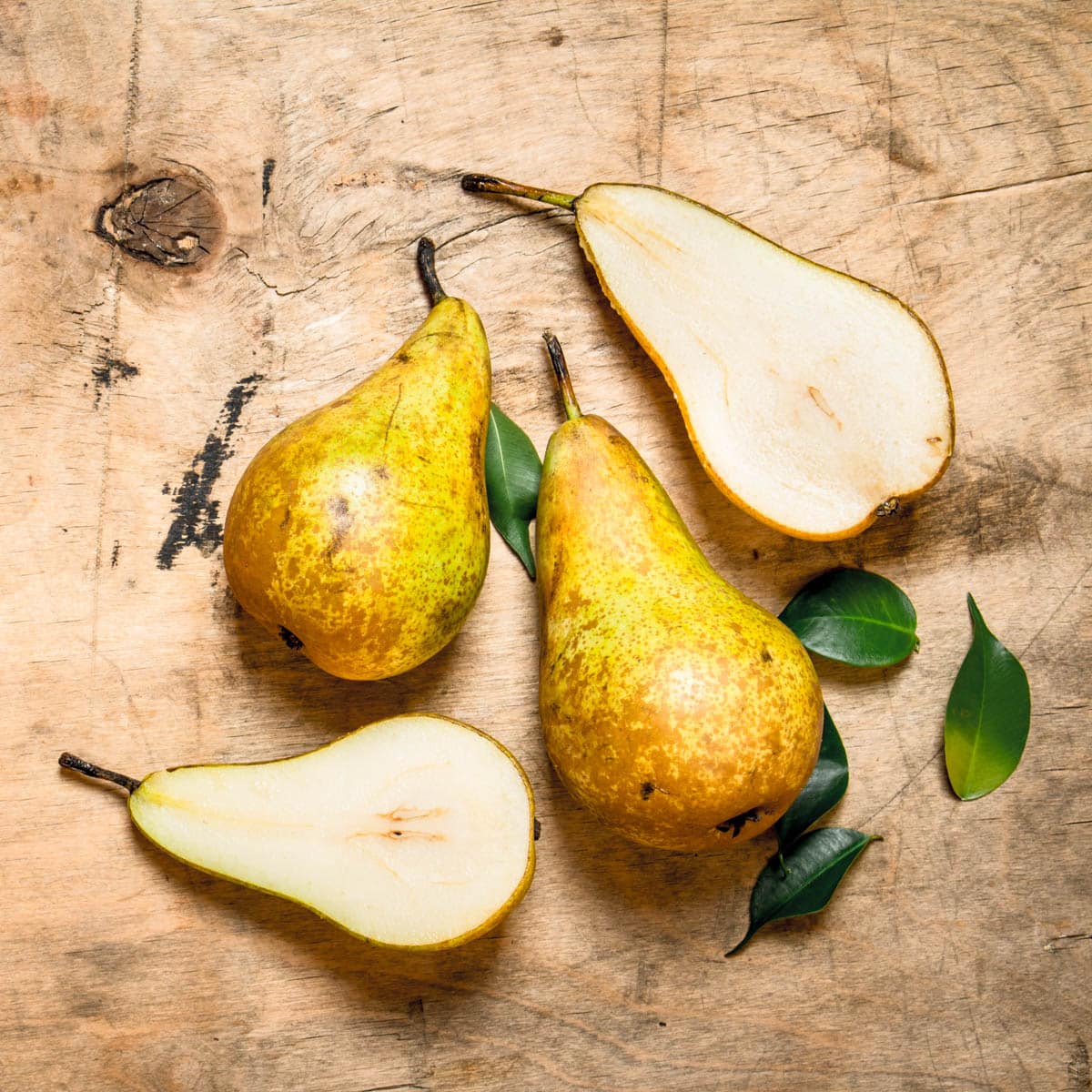 Fresh pears on a wooden background
