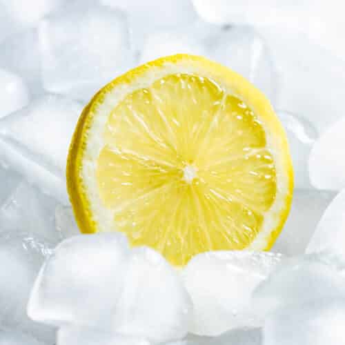 A slice of lemon in ice cubes.